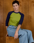 Alex wearing the Gross Green/Navy Colorblock Raglan Tee with the Light Wash Drop Pocket Pants