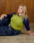 Juliet wearing the Gross Green/Navy Colorblock Raglan Tee