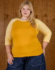 Juliet wearing the Mustard Yellow/Butter Raglan Tee