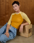 Alex in the Mustard Yellow/Butter Raglan Tee