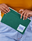 Pencil Pouch in Hunter Green held by model