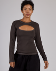Mika is 5'3" and wearing P Espresso Brown Long Sleeve Porthole Tee