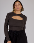 Tiara wearing the Espresso Brown Long Sleeve Porthole Tee tucked in