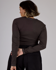 Back view of Tiara wearing the Espresso Brown Long Sleeve Porthole Tee