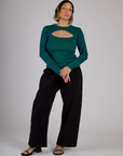 Tiara wearing the Hunter Green Long Sleeve Porthole Tee with Black Drop Pocket Pants