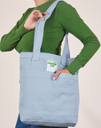 Everyday Tote Bag in Periwinkle worn over shoulder of model