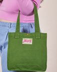 Shopper Tote in Lawn Green on arm of model