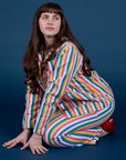 Sydney is wearing Work Pants in Rainbow Stripe paired with matching Work Jacket
