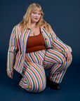 Juliet is wearing Work Pants in Rainbow Stripe and matching Work Jacket