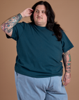 Sam is wearing Burly Tee in Lagoon