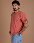Angled front view of Burly Tee in Raspberry Sorbet on Jesse