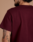Burly Tee in Red Wine back shoulder close up on Jesse
