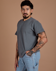 Angled front view of Burly Tee in Washed Grey on Jesse