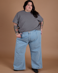 Burly Tee in Washed Grey and light wash Indigo Wide Leg Trousers on Sam