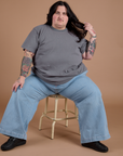 Burly Tee in Washed Grey and Indigo Wide Leg Trousers in Light Wash worn by Sam