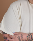 Close up of Burly Tee in Vintage Tee White sleeve on Sam