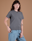 Angled front view of Burly Tee in Washed Grey on Alex