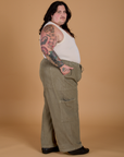 Side view of Corduroy Drop Pocket Cargo Pants in Khaki Grey and Tank Top in Vintage Tee Off-White on Sam