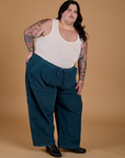 Sam is wearing Corduroy Drop Pocket Cargo Pants in Lagoon and Tank Top in Vintage Tee Off-White