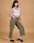 Angled front view of Corduroy Drop Pocket Cargo Pants in Khaki Grey and Cropped Tank in Vintage Tee White on Alex