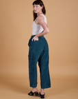 Corduroy Drop Pocket Cargo Pants in Lagoon angled back view on Alex