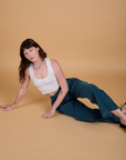Alex is wearing Corduroy Drop Pocket Cargo Pants in Lagoon and Cropped Tank in Vintage Tee White