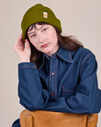 Alex is wearing Ribbed Beanie in Olive Green