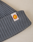 Ribbed Beanie in Slate Grey close up of sun baby tag