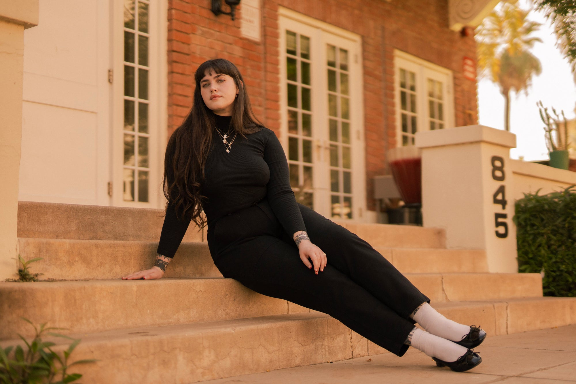 Sydney is wearing Essential Turtleneck in Basic Black and Pencil Pant in Black