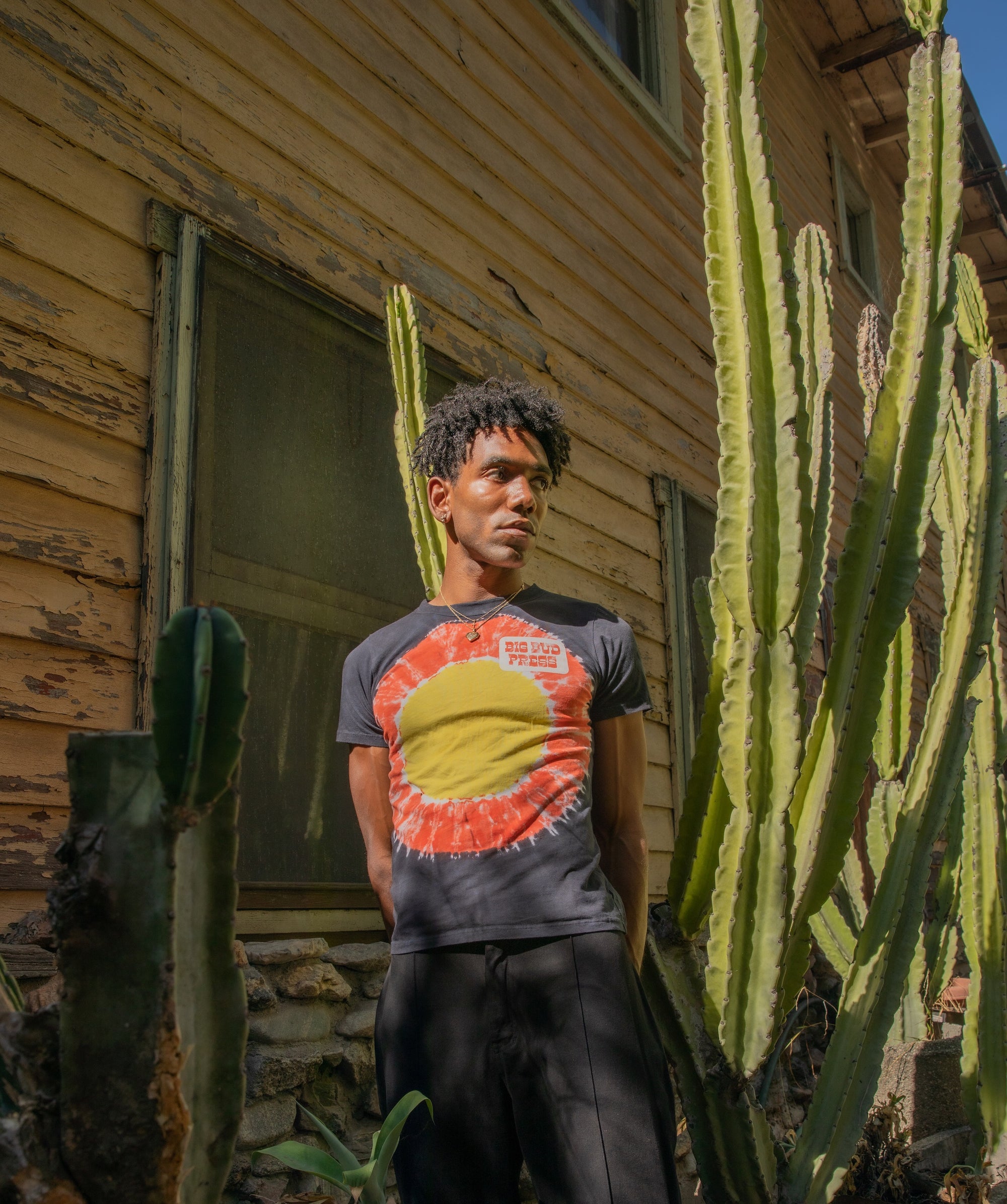 Jerrod wearing Tie Dye Tee in Black Eclipse and Western Pants in Basic Black