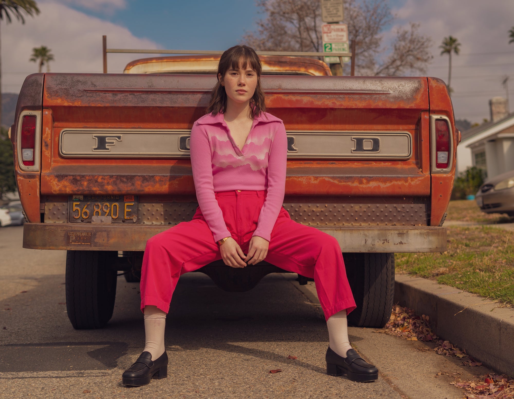 Hana wearing Airbrush Long Sleeve Fisherman Polo in Bubblegum Pink and Trousers in Hot Pink
