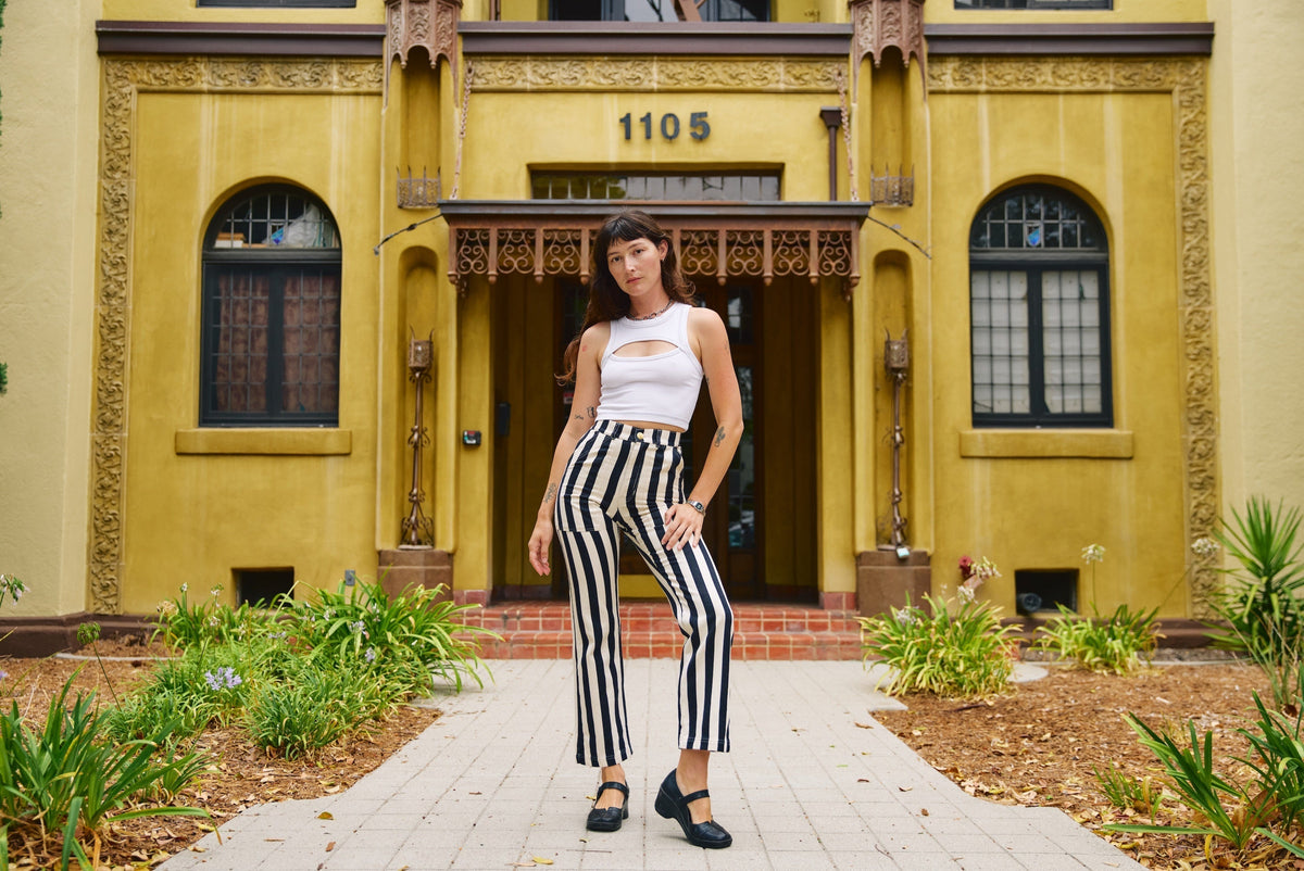 Alexandra Skye is wearing Black Stripe Work Pants in Natural and Porthole Tank in Vintage Tee White