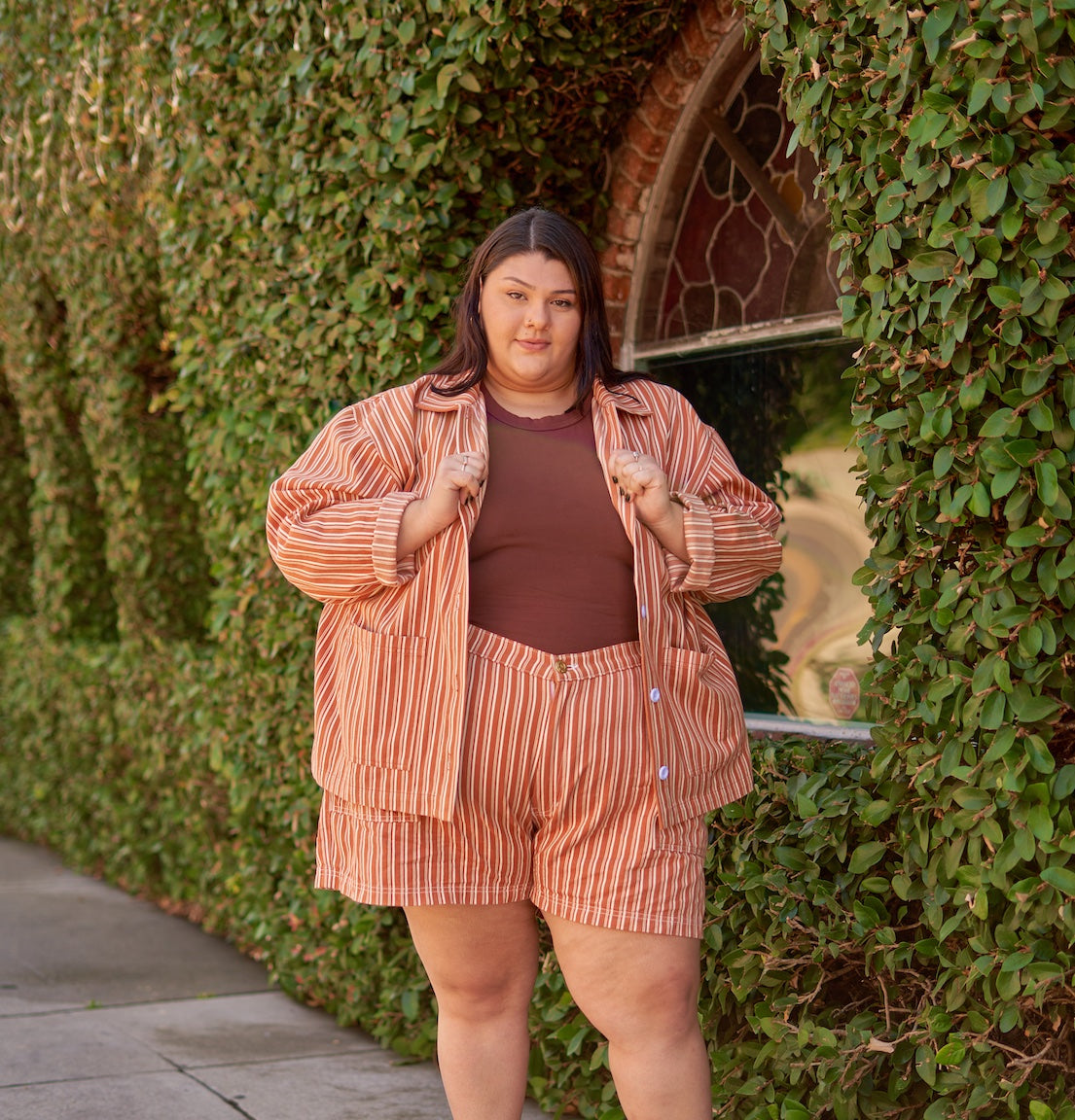 Sarita wearing Work Jacket and Work Shorts in Clay stripe