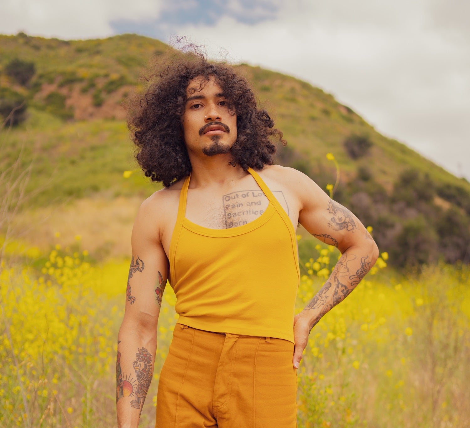 Jesse is wearing Halter Top in Mustard Yellow and Western Pants in Spicy Mustard