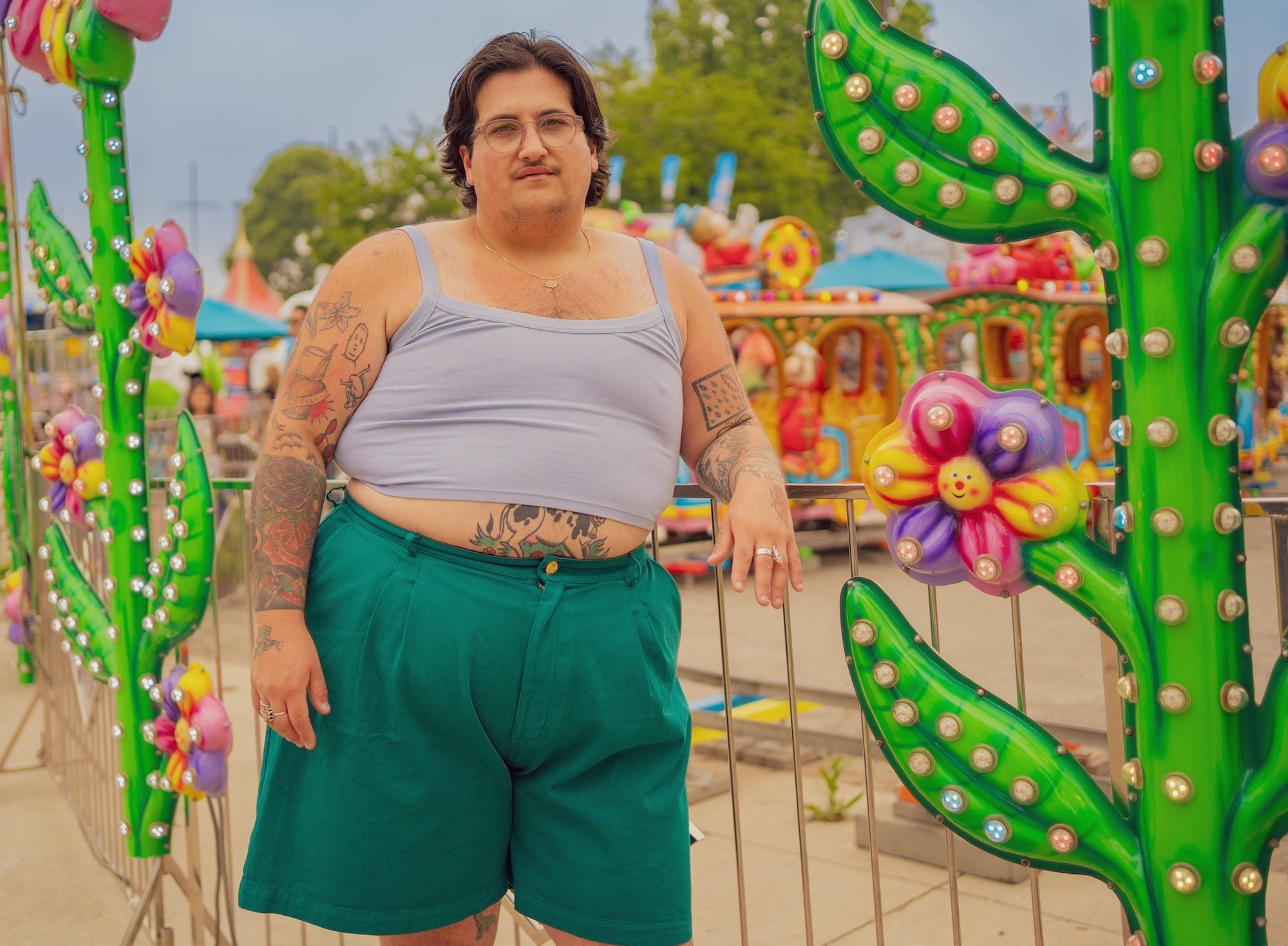 Sam is wearing Cropped Cami in Periwinkle and Trouser Shorts in Hunter Green