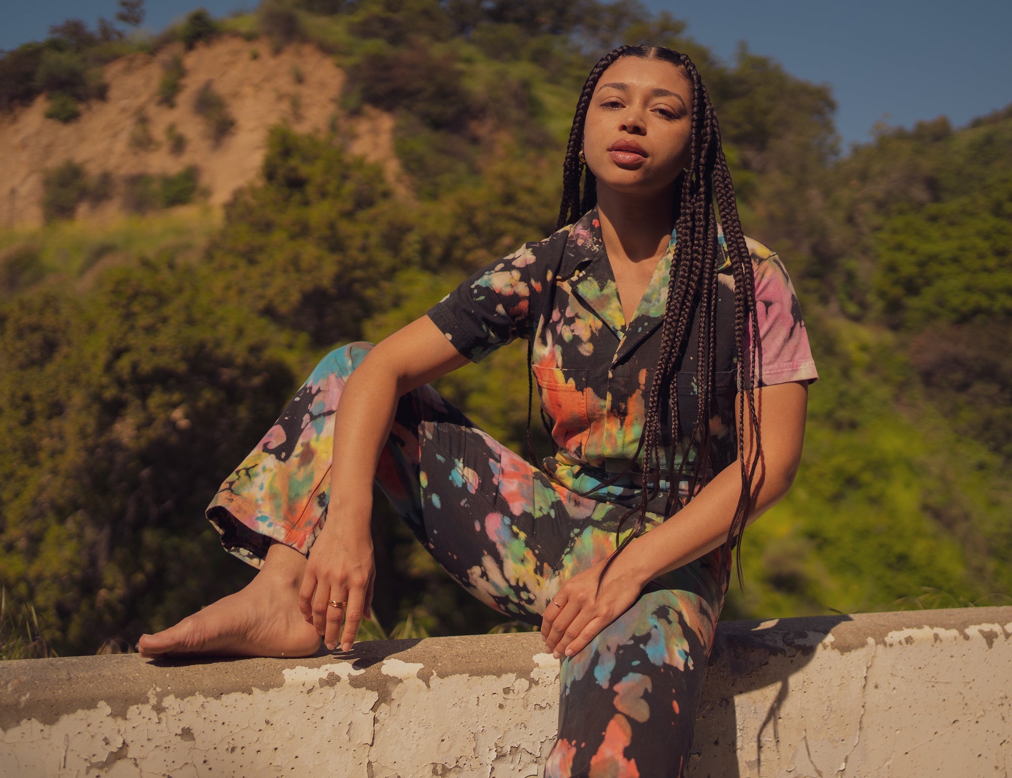 Gabrielle wearing Short Sleeve Jumpsuit in Rainbow Magic Waters