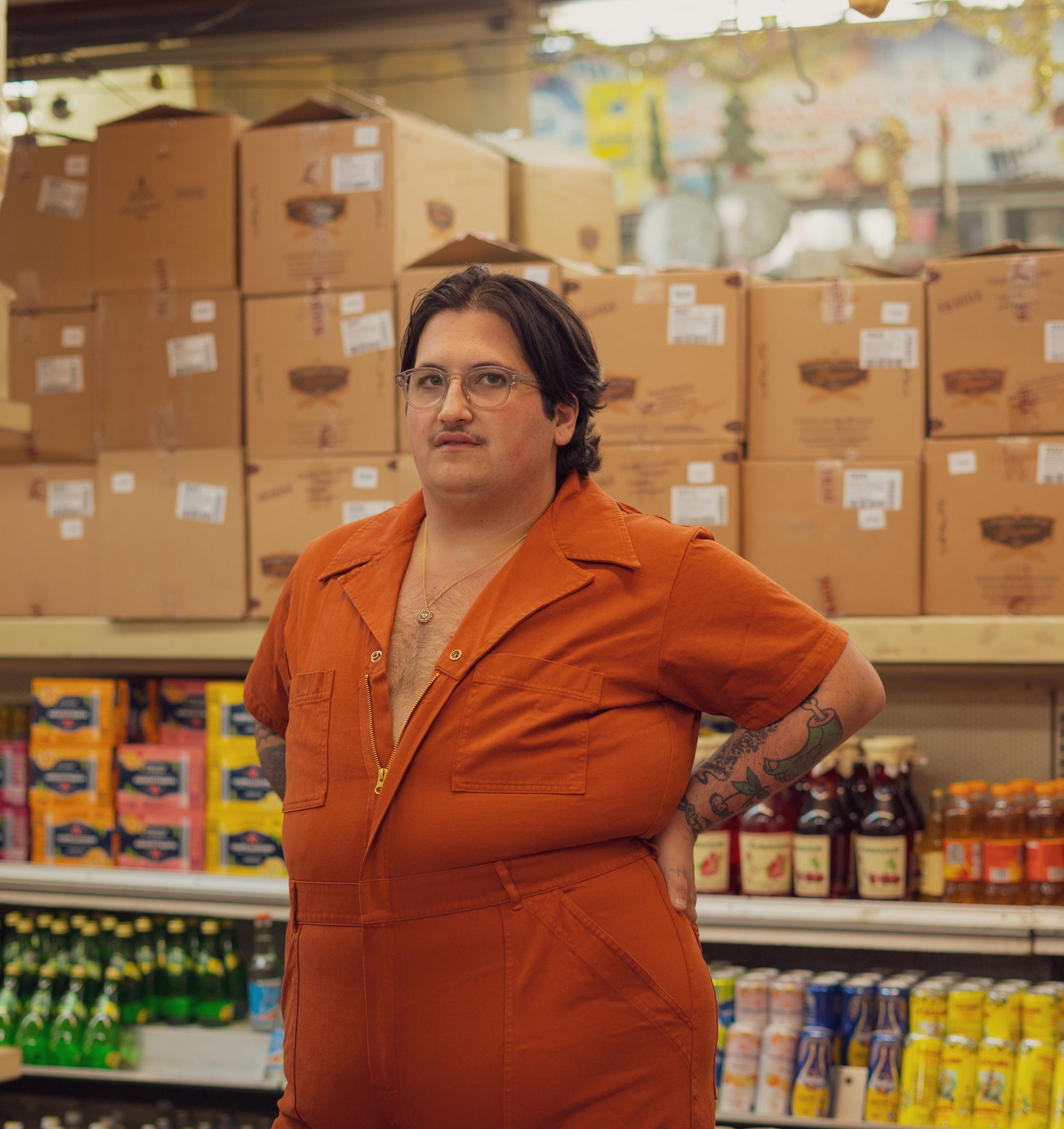 Sam Wearing Short Sleeve Jumpsuit in Burnt Terracotta