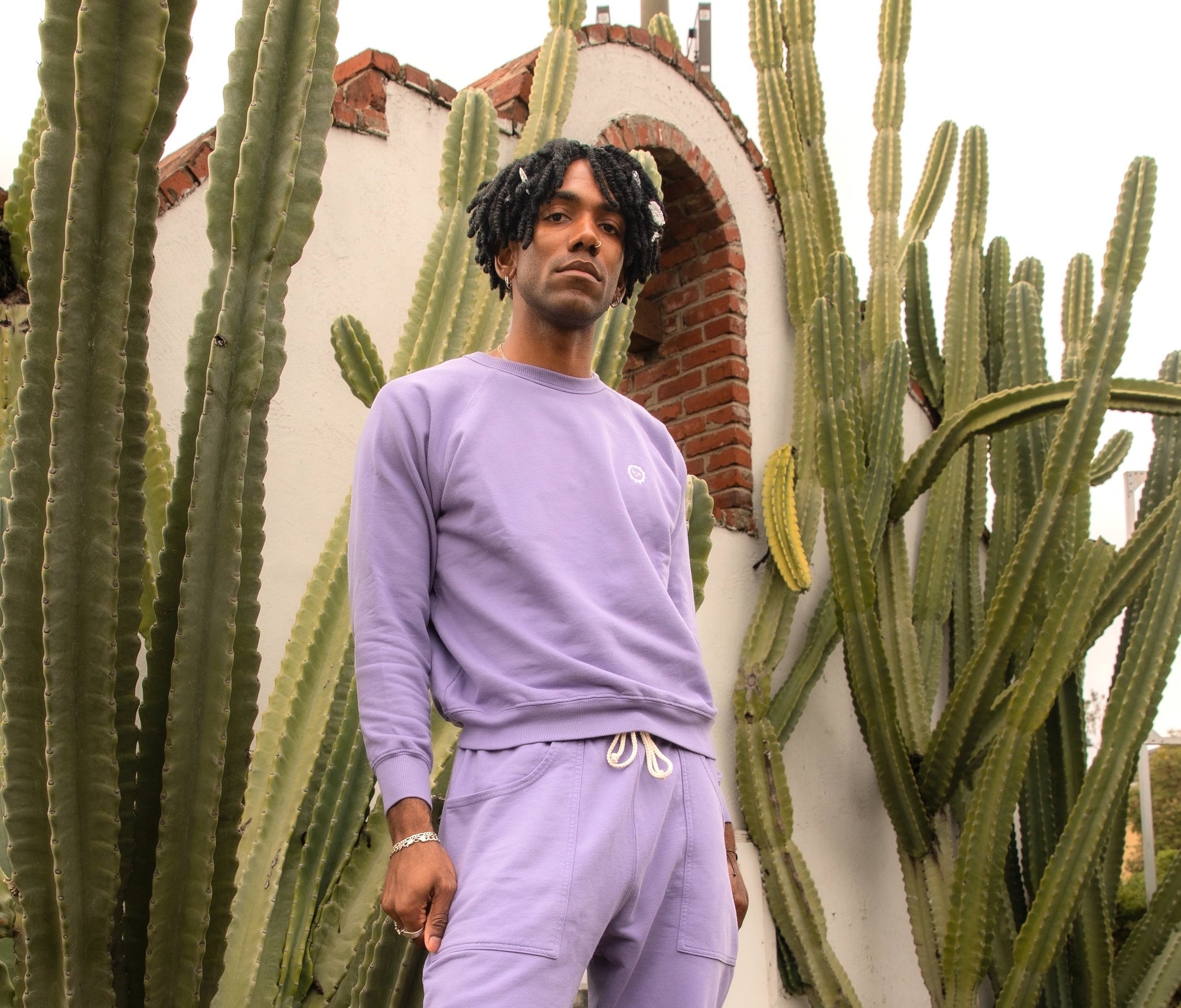 Jerrod wearing Crew Sweatshirt in Faded Grape and matching Sweat Pants