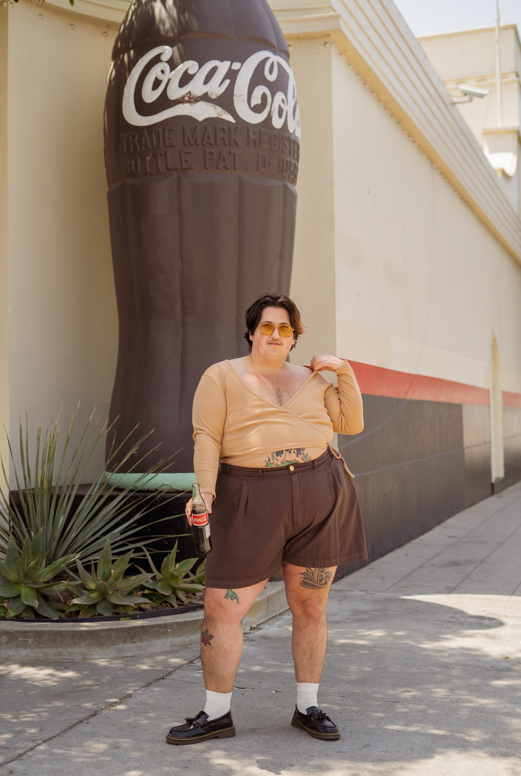 Sam wearing Wrap Top in Tan and Trouser Shorts in Espresso Brown