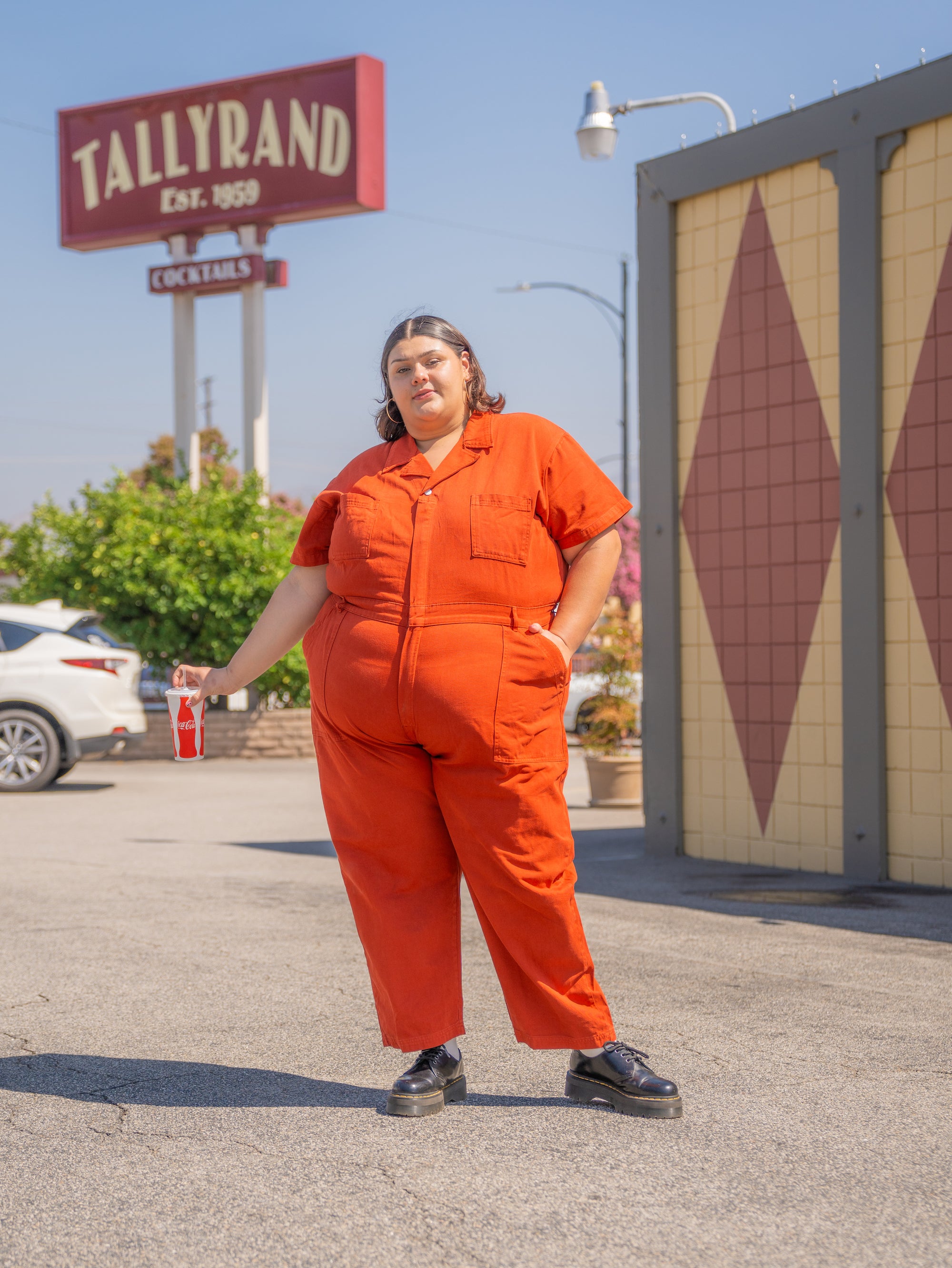 Sarita is wearing Short Sleeve Jumpsuit in Paprika
