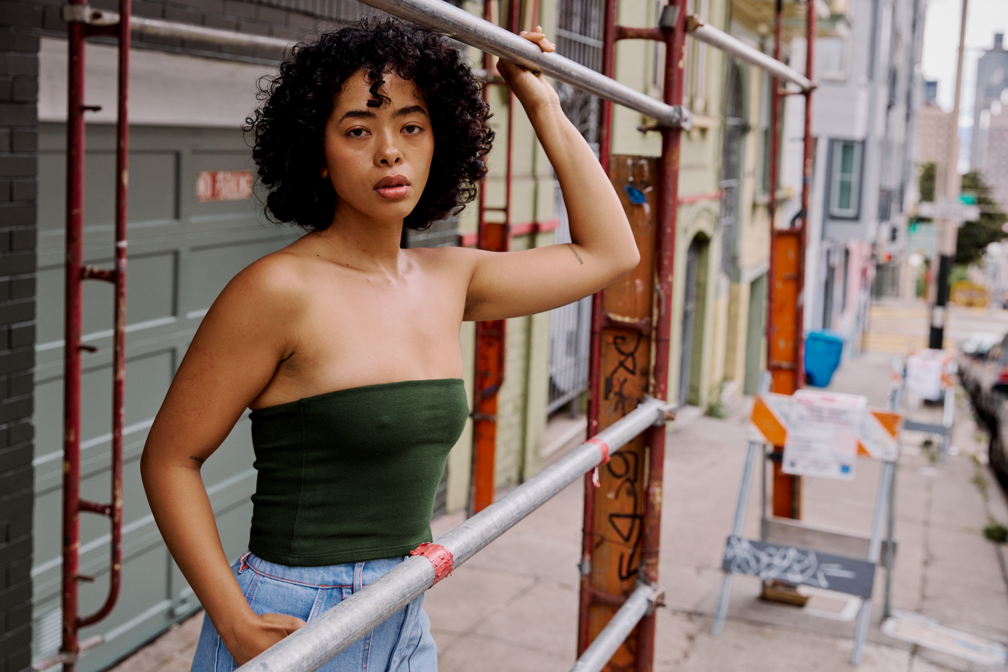 Mika is wearing Tube Top in Evergreen and Carpenter Shorts in Light Wash