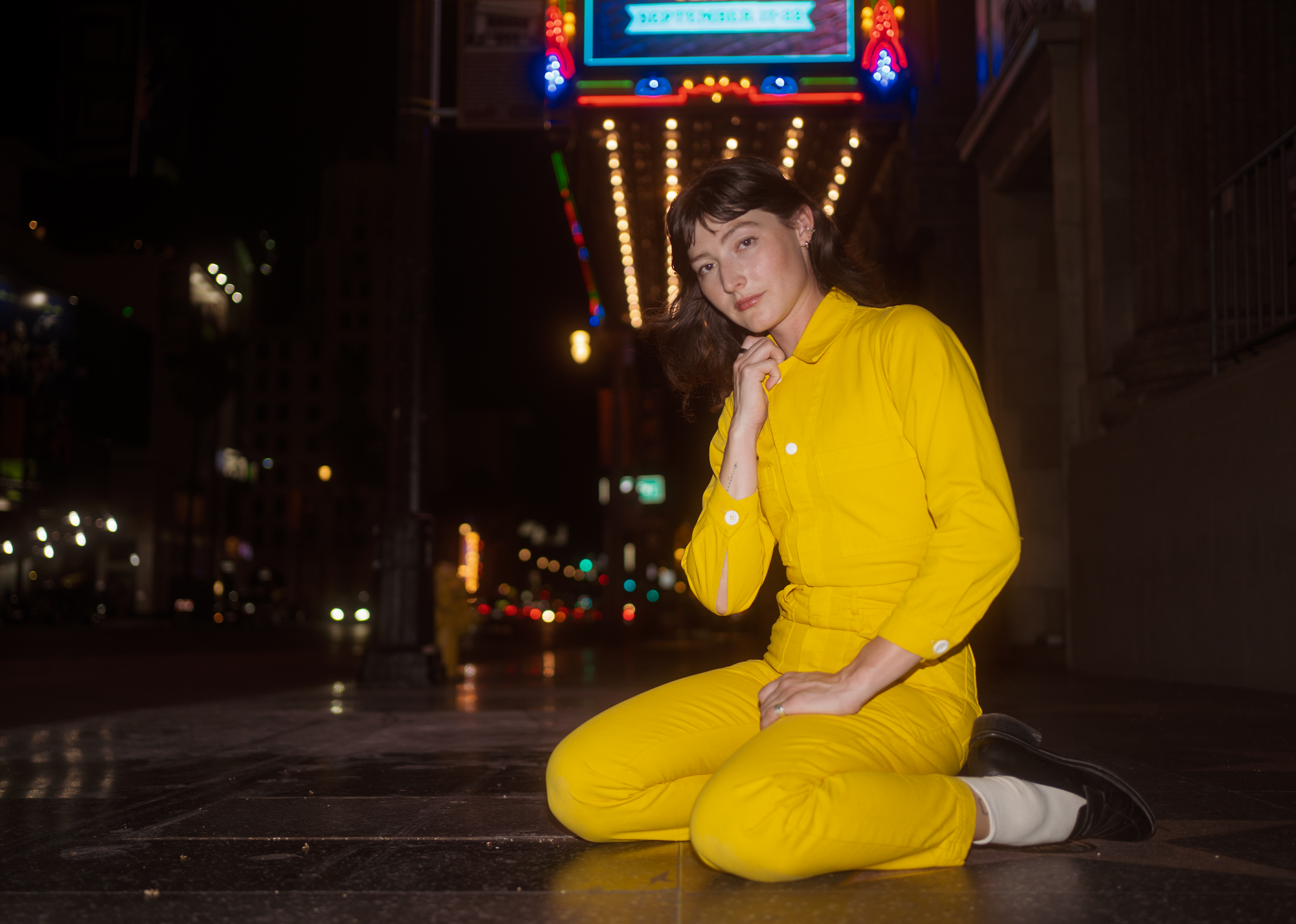 Alexandra Skye is wearing Long Sleeve Jumpsuit in Golden Yellow