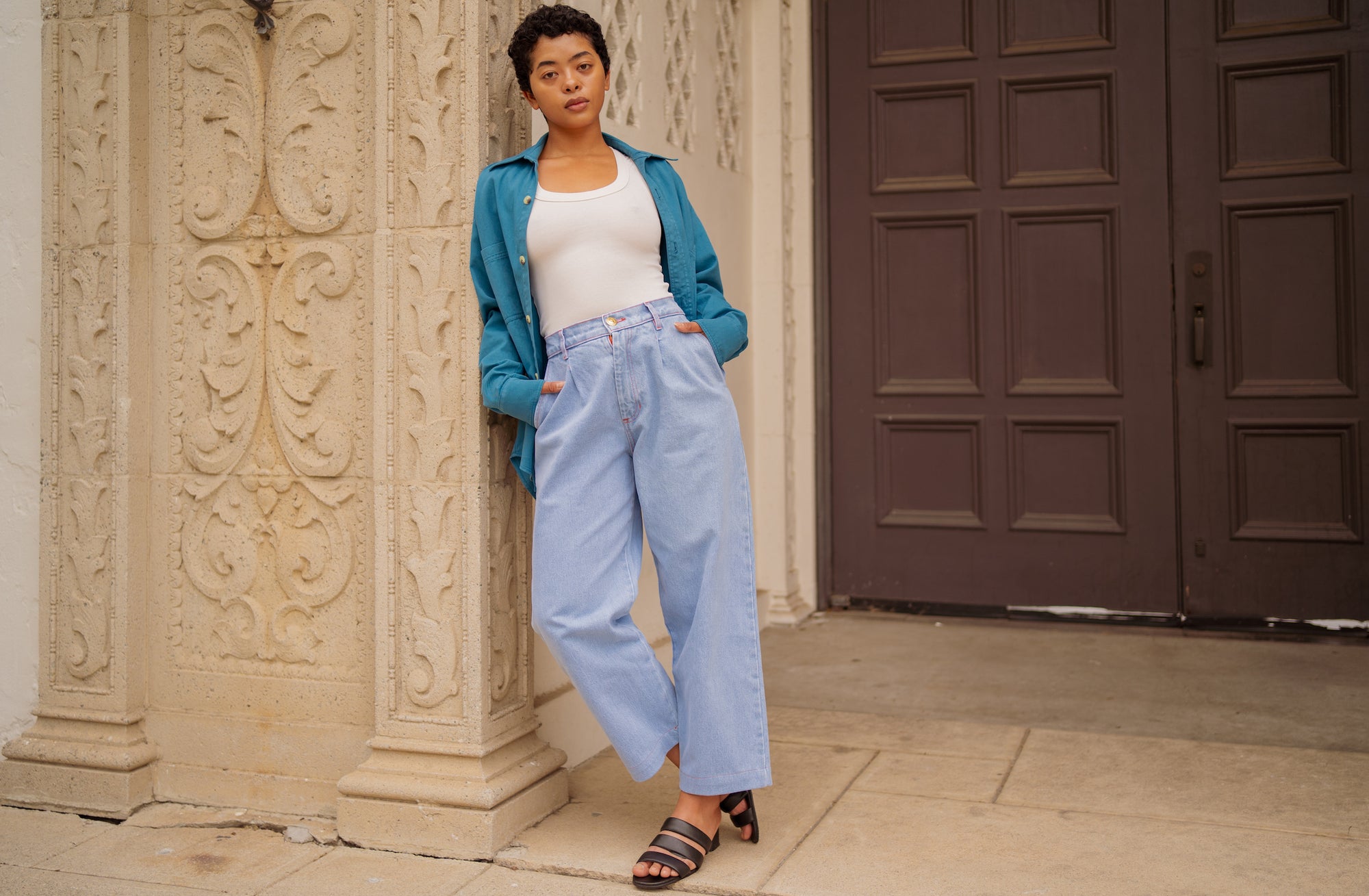 Mika is wearing Petite Denim Trousers in Light Wash, Tank Top in Vintage Off-White, and Overshirt in Marine Blue