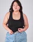 Ashley is 5'7" and wearing L Cropped Tank Top in Basic Black