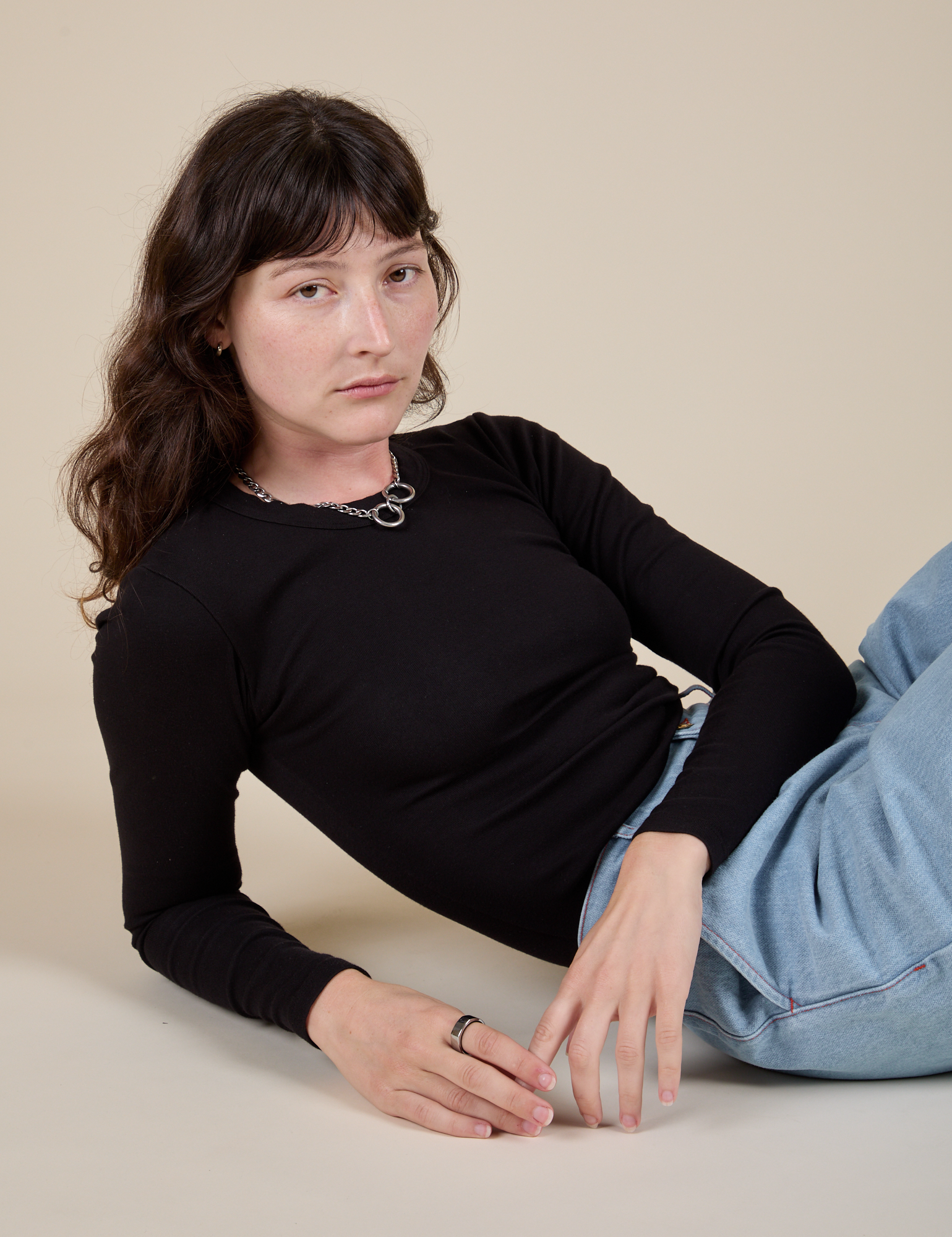Alex is wearing Long Sleeve Baby Tee in Basic Black