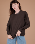 Alex is 5’8” and wearing P Long Sleeve Burly Tee in Espresso Brown