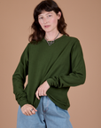 Alex is 5’8” and wearing P Long Sleeve Burly Tee in Evergreen