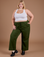 Juliet is 5'8" and wearing 1XL Organic Action Pants in Evergreen paired with vintage tee white Cropped Tank Top
