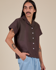 Anthony is 5’6” and wearing S Pantry Button-Up in Espresso Brown