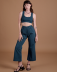 Alex is 5’8” and wearing XXS Action Pants in Lagoon paired with lagoon Mini Tank